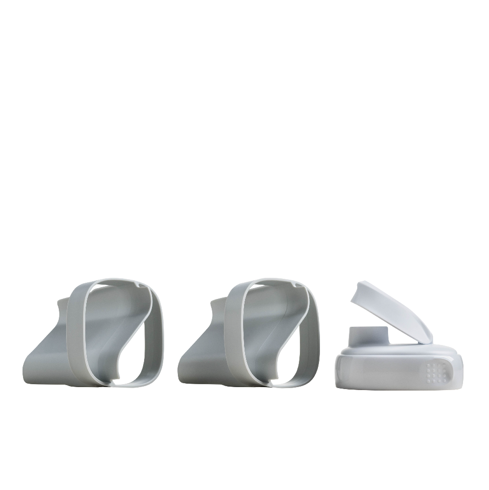 Three white plastic components on a white background