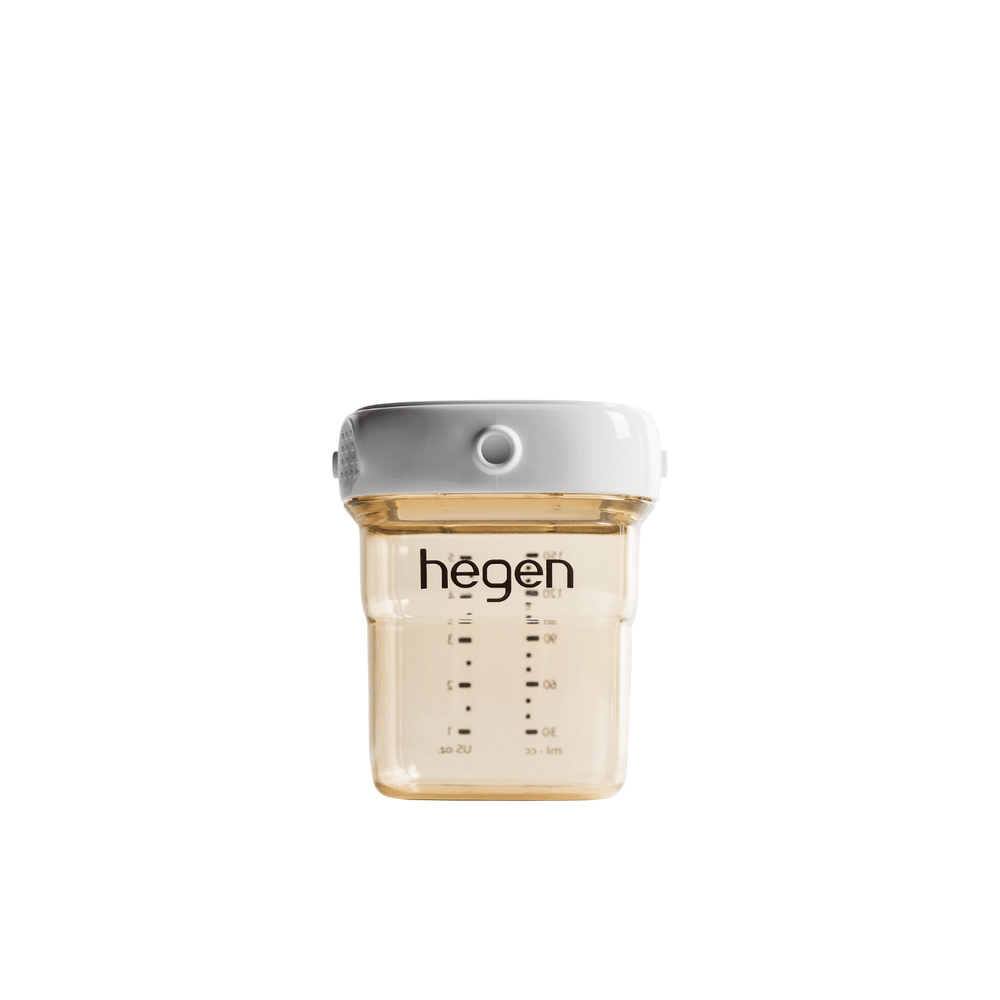 A 150ml/5oz Hegen PCTO breast milk storage container with measurement markings and a white lid.