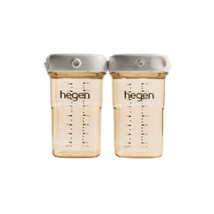 Two transparent Hegen breast milk storage containers with measurement markings and white lids.