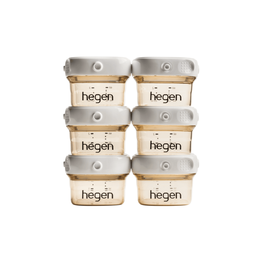 A set of six Hegen branded breast milk storage containers in a stack, with a white and gold color scheme.