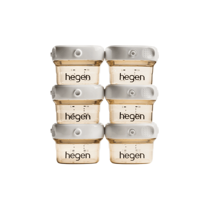 A set of six Hegen branded breast milk storage containers in a stack, with a white and gold color scheme.