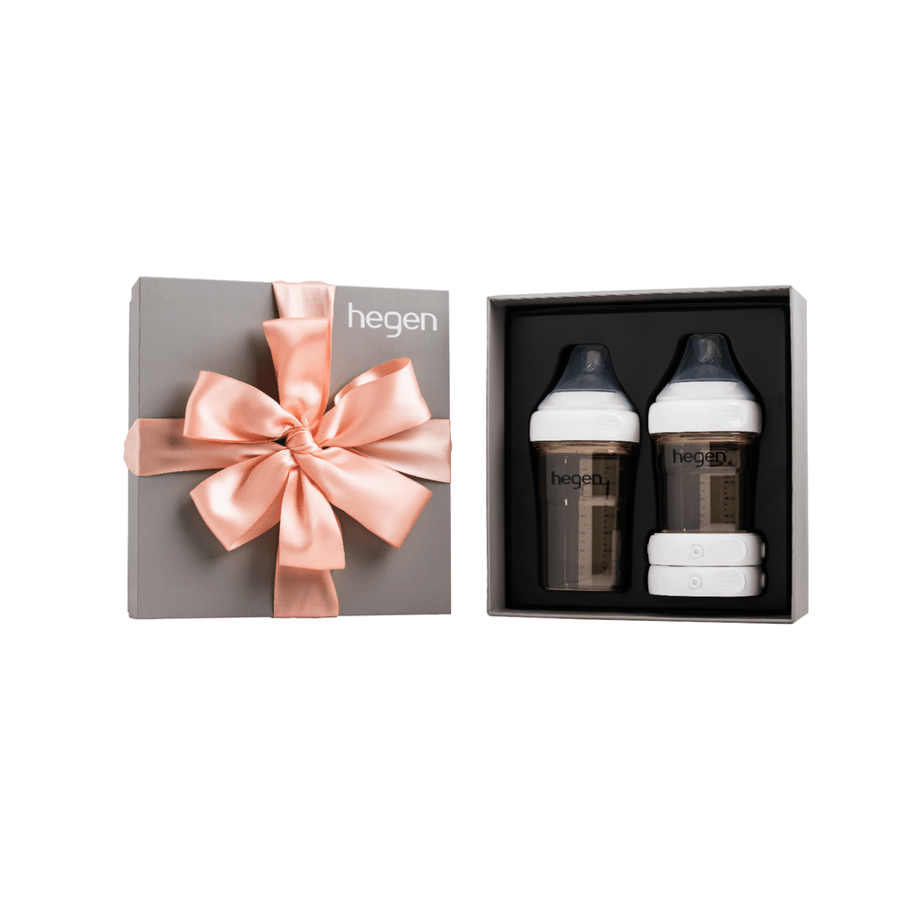 Hegen PCTO Basic Starter Kit PPSU presented in a box with two baby bottles, breast milk storage lids, and a decorative pink ribbon.