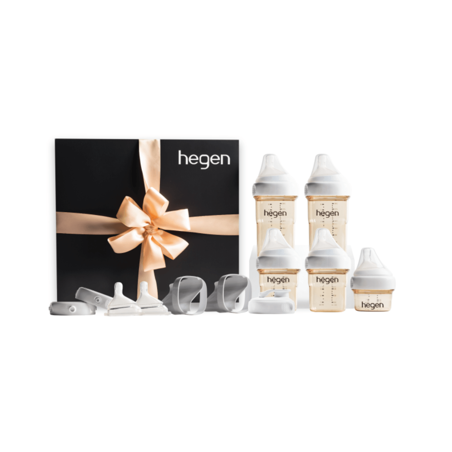 A Hegen PCTO Complete Starter Kit with various feeding bottles and accessories, presented in a black box with a gold ribbon.