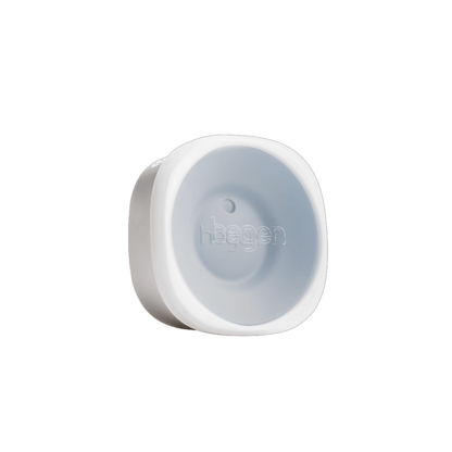A white Hegen all-rounder crown designed as a training cup accessory, with a soft silicone disc visible.