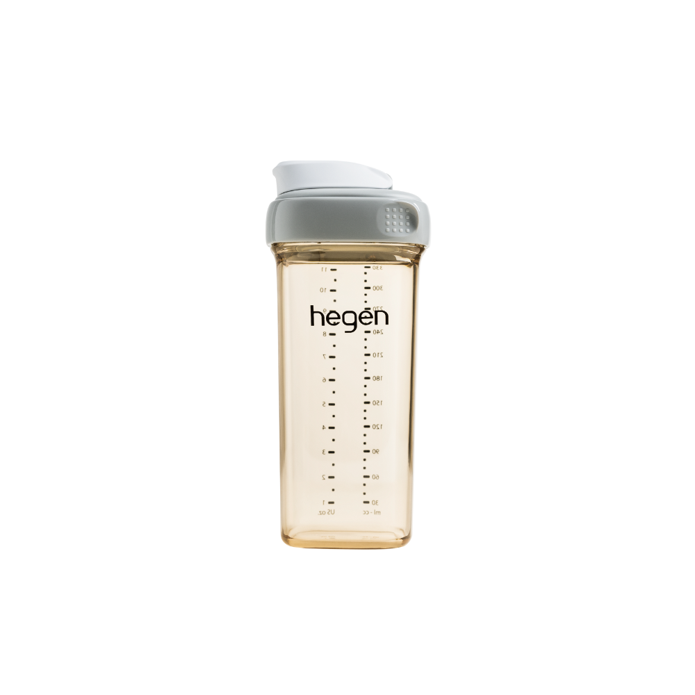A transparent drinking bottle with gray cap and measurement markings, branded with &
