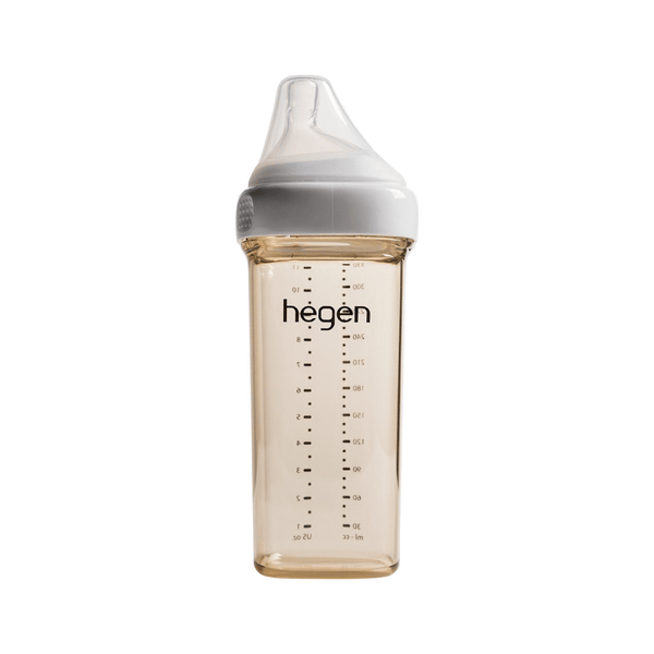 A 330ml/11oz Hegen feeding bottle with a fast flow teat designed for babies 6 months and beyond, in a clear color with measurement markings.