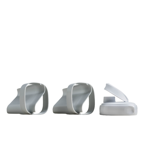 Three white plastic components on a white background