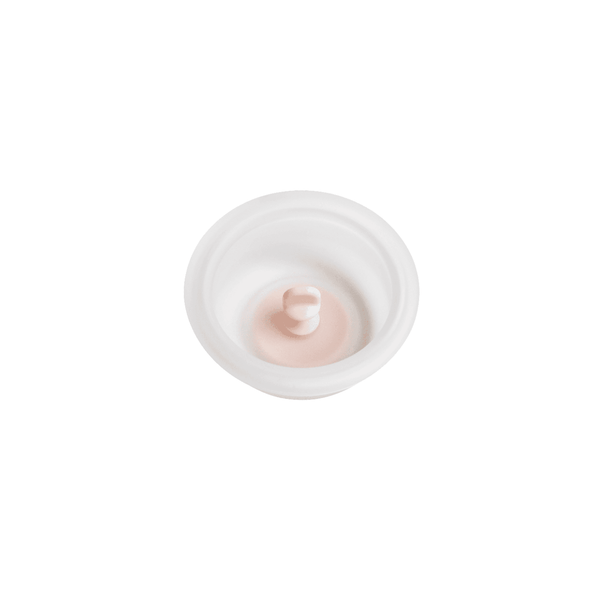 A white manual breast pump diaphragm with a soft, squishy texture, designed for use with a breast pump.