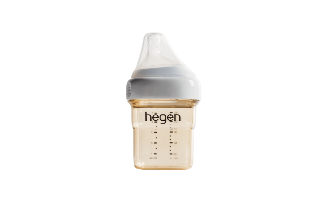 A 150ml/5oz Hegen feeding bottle with a slow flow teat, marked with measurement lines, against a white background.