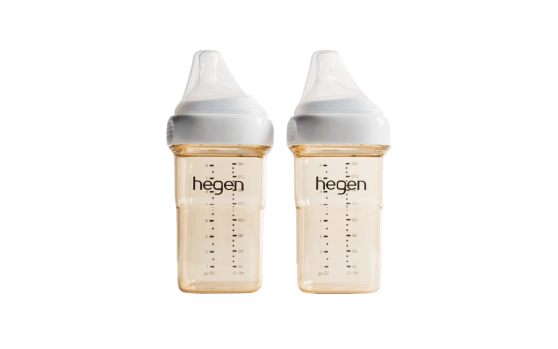 Two Hegen PCTO 240ml/8oz feeding bottles with medium flow teats, against a white background.