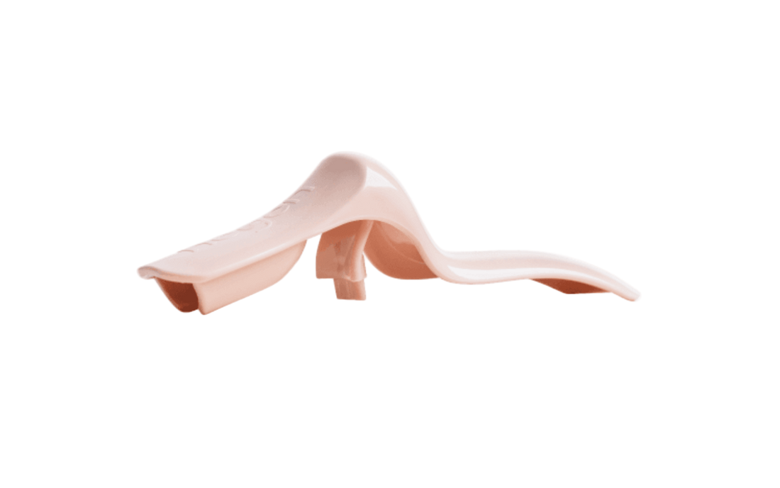 A soft pink manual breast pump handle designed to attach to a breast shield pump body connector.