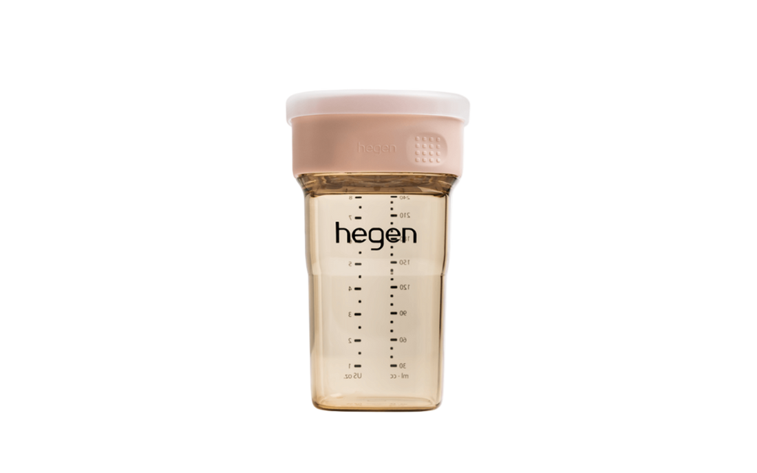 A pink Hegen PCTO 240ml/8oz all-rounder cup with measurement markings, designed for babies.