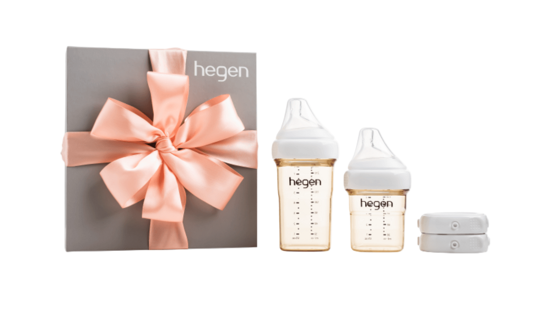Hegen PCTO Basic Starter Kit PPSU presented in a box with two baby bottles, breast milk storage lids, and a decorative pink ribbon.