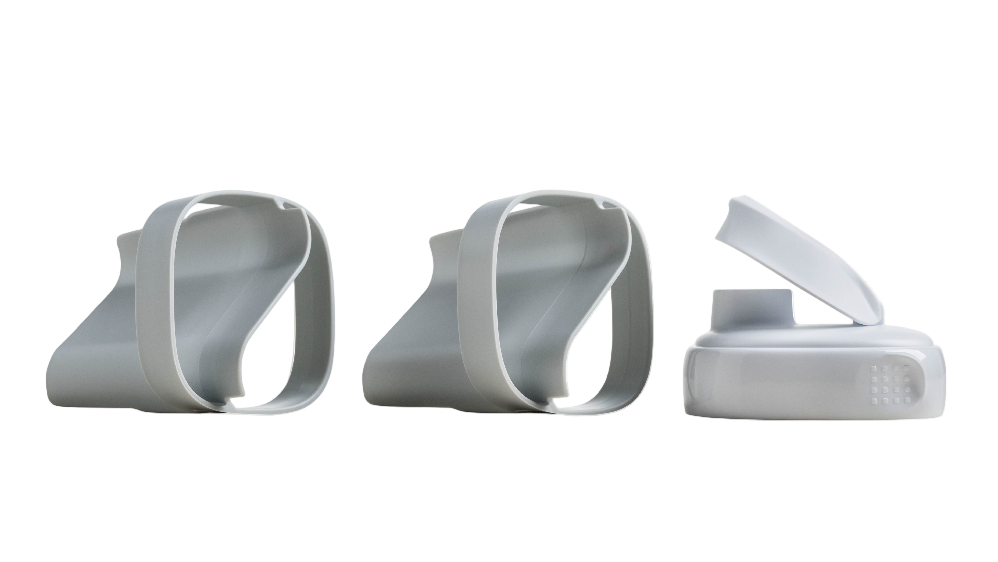 Three white plastic components on a white background
