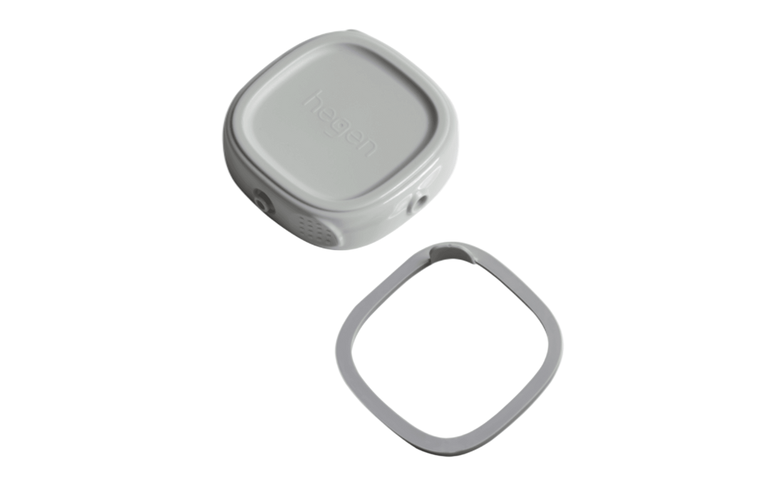A gray Hegen breast milk storage container lid and its corresponding silicone seal ring.