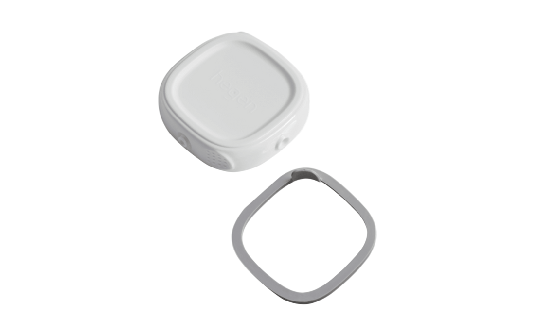A white Hegen PCTO Breast Milk Storage Lid with its corresponding silicone seal.