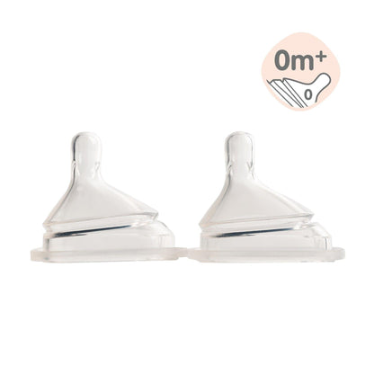 Two transparent silicone teats designed for baby bottles, marked with an &